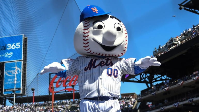 Mr. Met entertains fans during the Mets' home opener against...