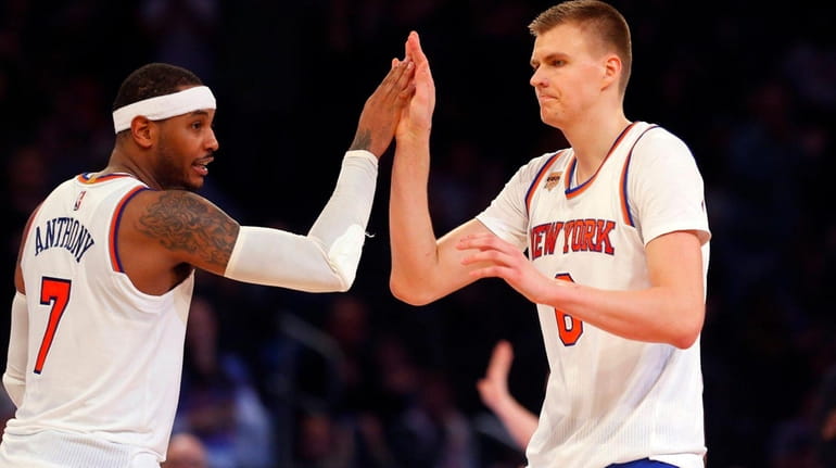Carmelo Anthony and Kristaps Porzingis celebrate after a basket against...