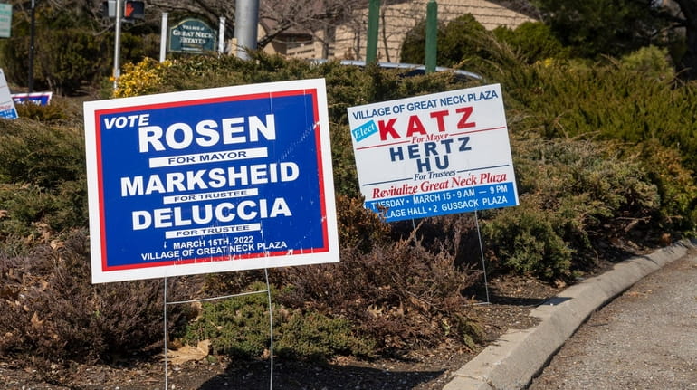 Election signs in Great Neck Plaza for the trustee and...
