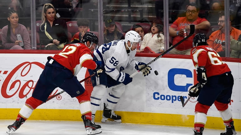 Toronto Maple Leafs left wing Michael Bunting (58) tries to...