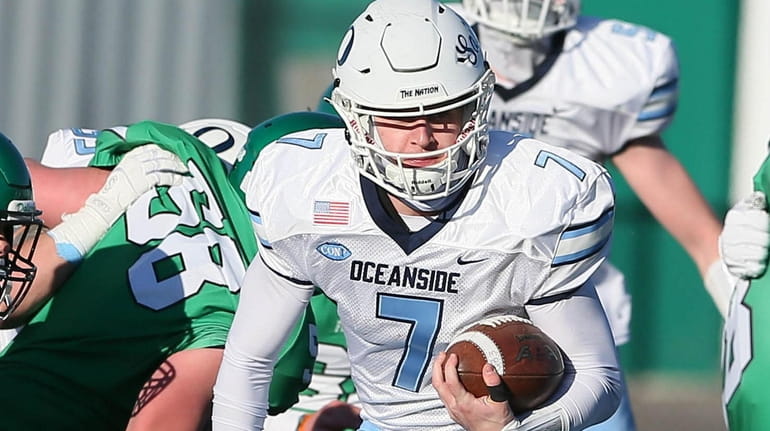Oceanside's Charlie McKee runs the ball in the second quarter...