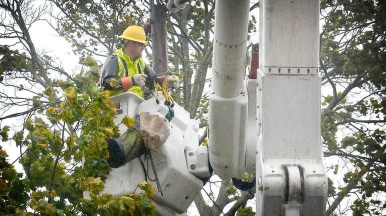 LIPA electrical contractors work to restore power in Patchogue during...