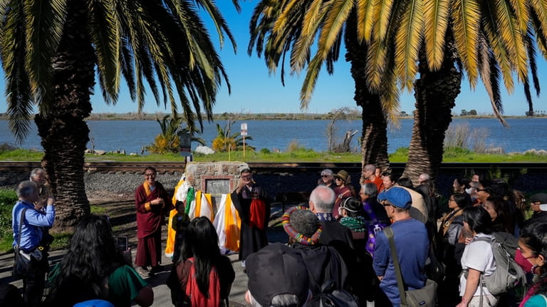 Buddhist faith leaders and community members gather at the Birthplace...