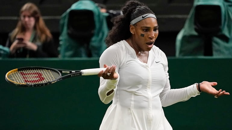 Serena Williams reacts after losing a point as she plays Harmony...