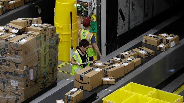 Packages move down a conveyor system were they are directed...