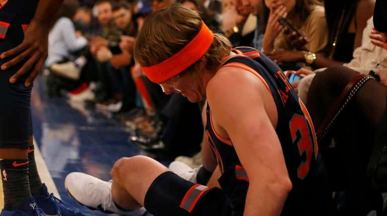 Ron Baker #31 of the New York Knicks reacts after...