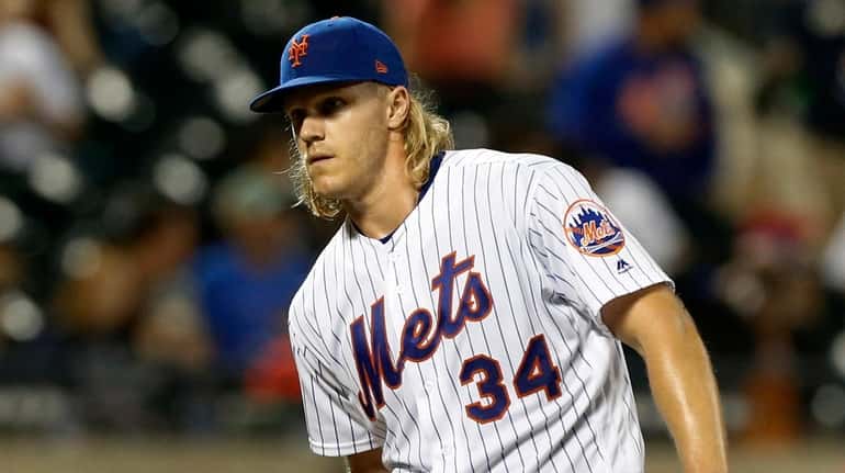 Noah Syndergaard #34 of the Mets stands on the mound prior...