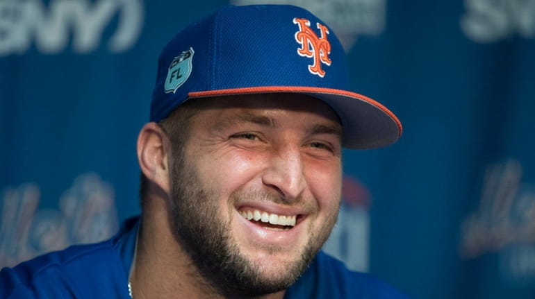 Mets outfielder Tim Tebow talks during a press conference at...