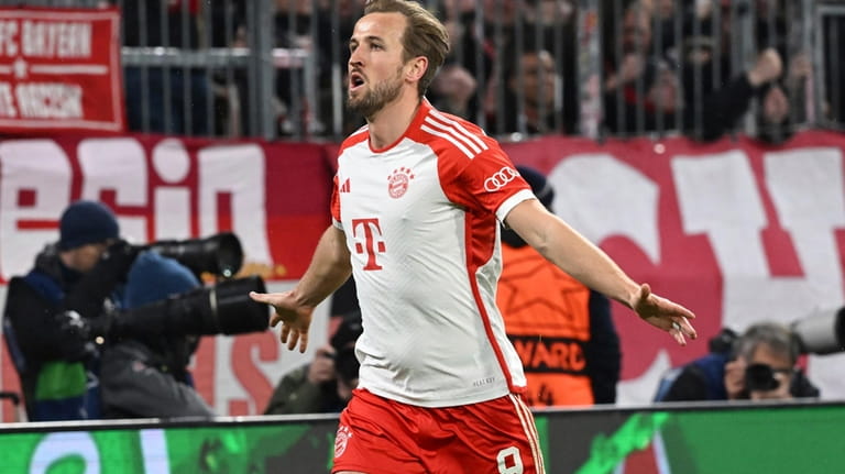 Bayern's Harry Kane celebrates after scoring his side's third goal...