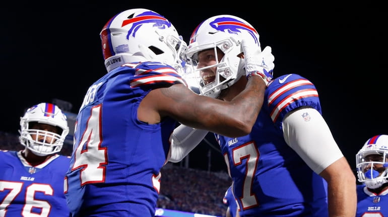 Buffalo Bills' Stefon Diggs, second from left, celebrates with quarterback...