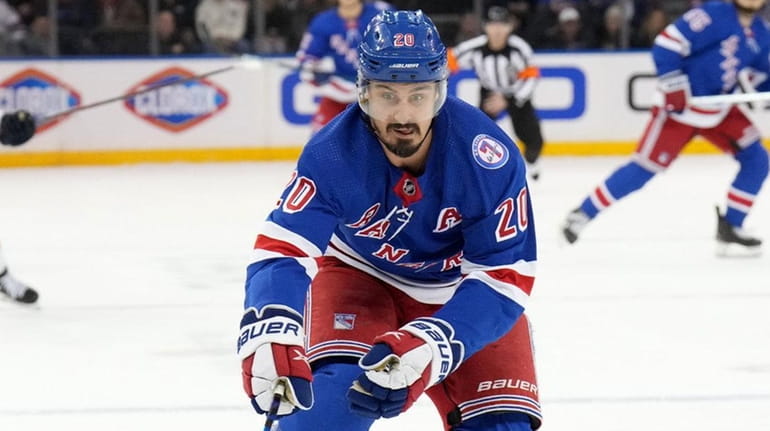 Chris Kreider of the Rangers with the puck during game...