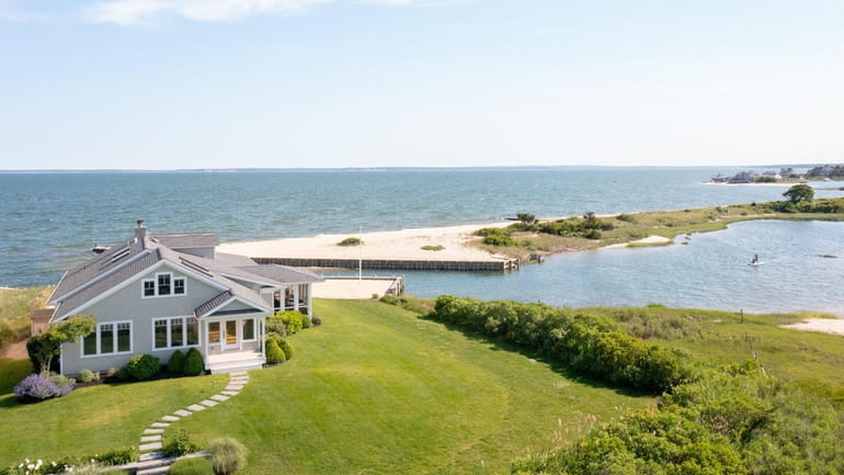 The three-bedroom, 2½ bath Cape has panoramic water views and its own...