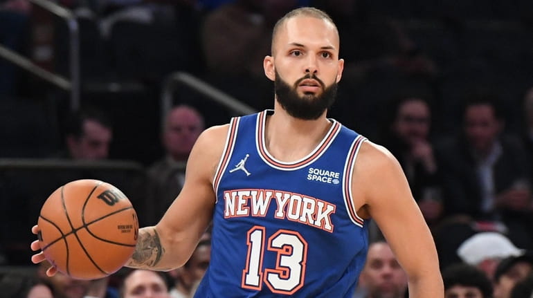Knicks guard Evan Fournier looks to pass the ball against...