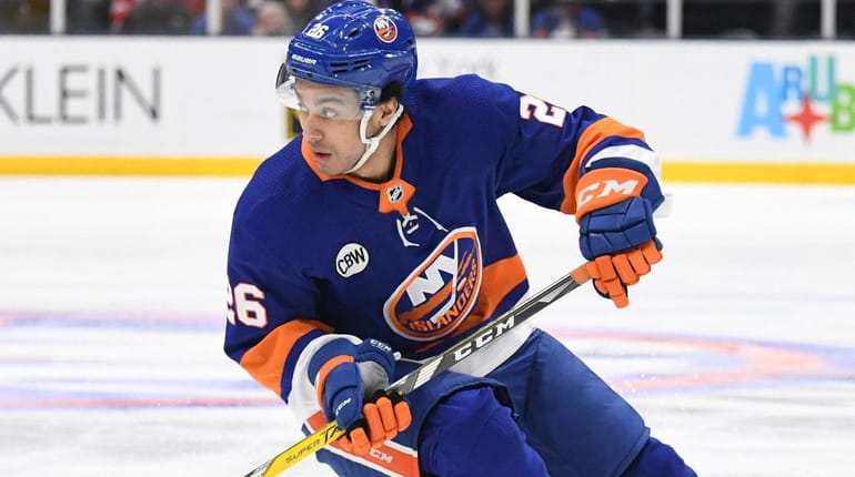 New York Islanders right wing Josh Ho-Sang skates with the...