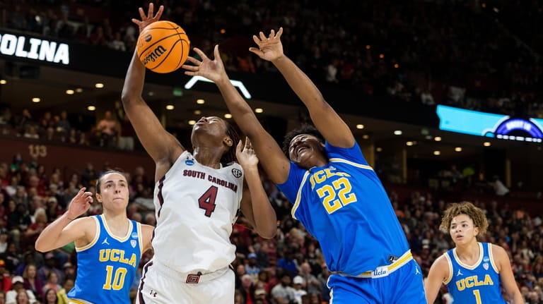 South Carolina's Aliyah Boston (4) fights for a rebound over...