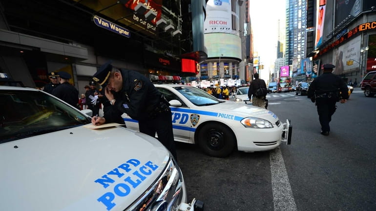 Police officers man their post at Times Square in Manhattan...