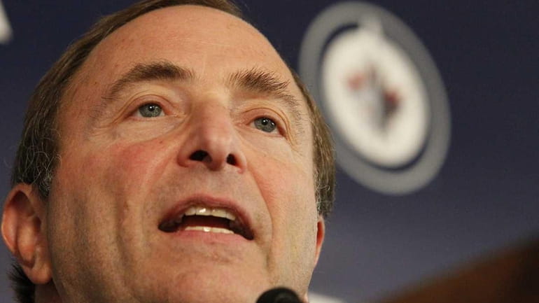NHL commissioner Gary Bettman talks to the media before the...