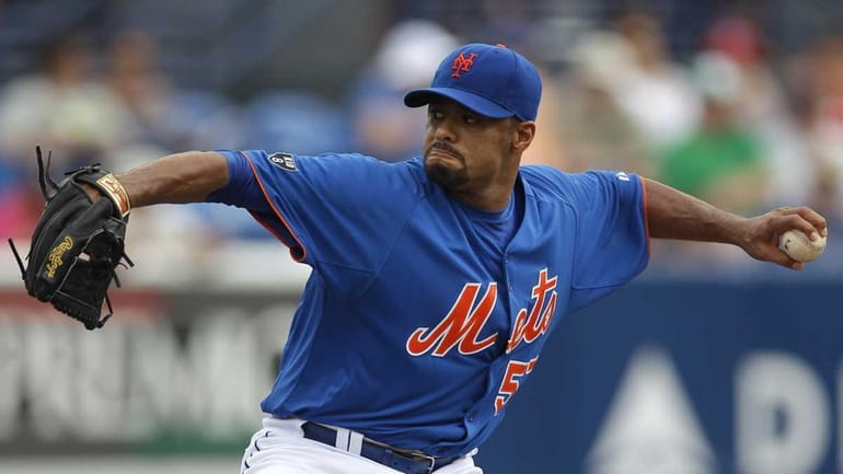 Johan Santana throws against the Miami Marlins in the first...