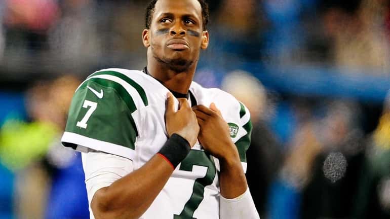Geno Smith watches the scoreboard during the final minute of...