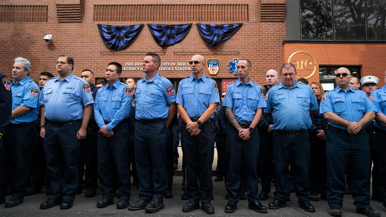 FDNY personnel and members of EMS Station 49 in Astoria...