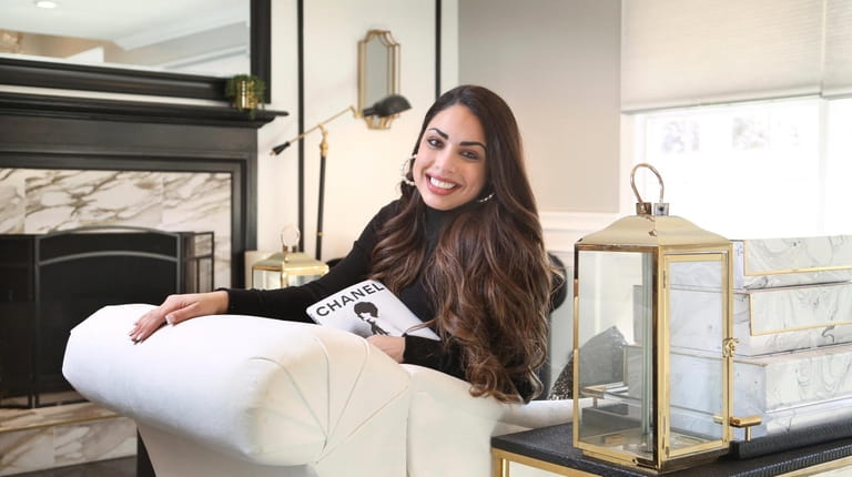 Christina Tavarez in the Chanel-inspired living room of the Stony Brook home...
