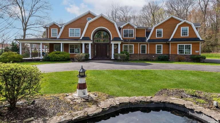 Priced at $2.695 million, this Colonial on Old Country Road...