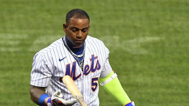 Mets designated hitter Yoenis Cespedes returns to the dugout after...