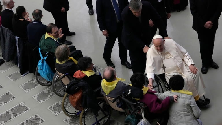 Pope Francis leaves after an audience with the dioceses of...