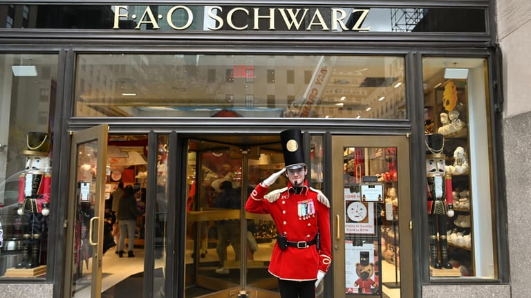 A doorman greets visitors to FAO Schwarz in Rockefeller Center.