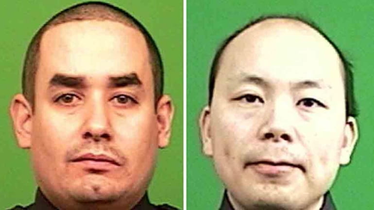Officers Rafael Ramos, 40, and Wenjian Liu, 32, both of...