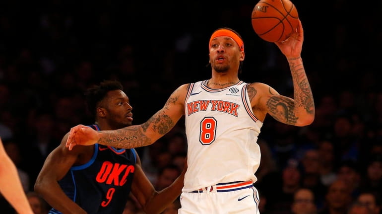 Michael Beasley of the New York Knicks controls the ball...