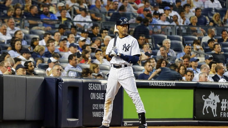 Derek Jeter of the Yankees waits to bat in the...