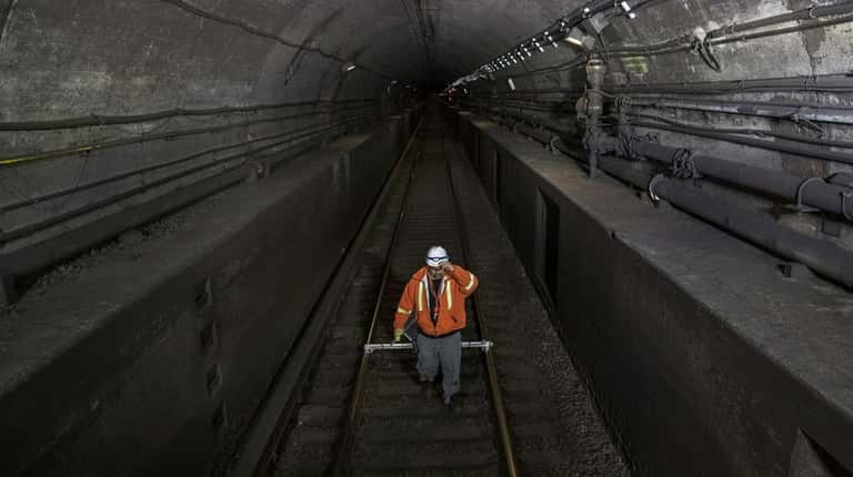 A worker photographed on the tracks under the Hudson River...