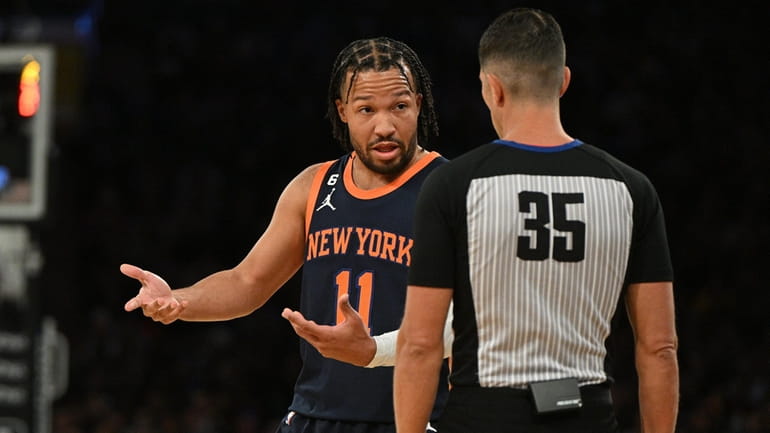 Knicks guard Jalen Brunson talks with referee Jason Goldenberg in...
