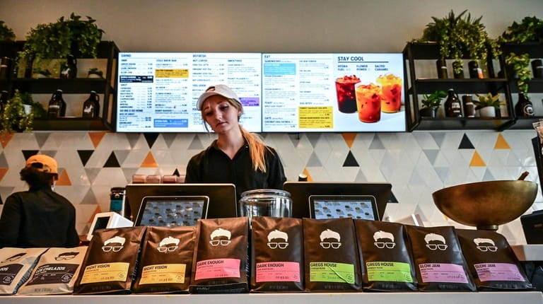 General assistant Meaghan Minogue works the counter at Gregorys Coffee...