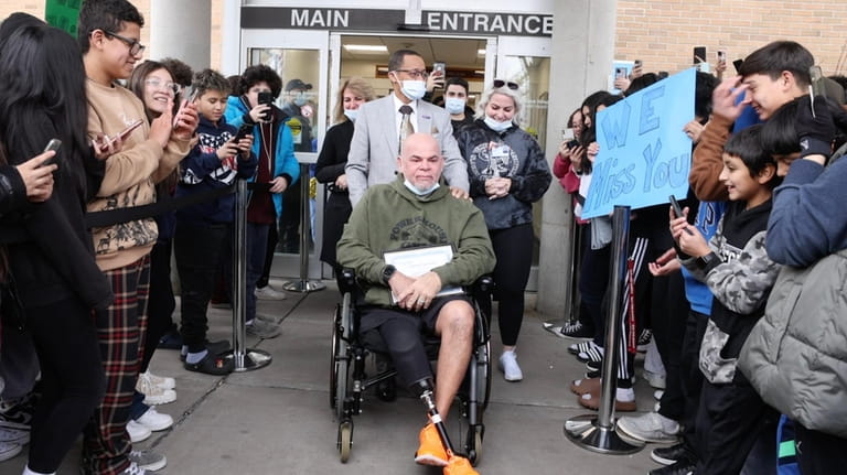 Carlos Vazquez leaves Glen Cove Hospital to cheers on Tuesday.