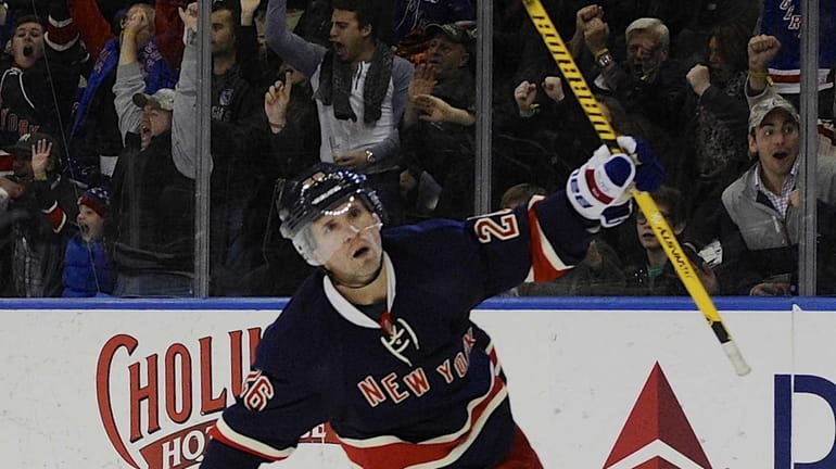 New York Rangers right wing Martin St. Louis celebrates his...