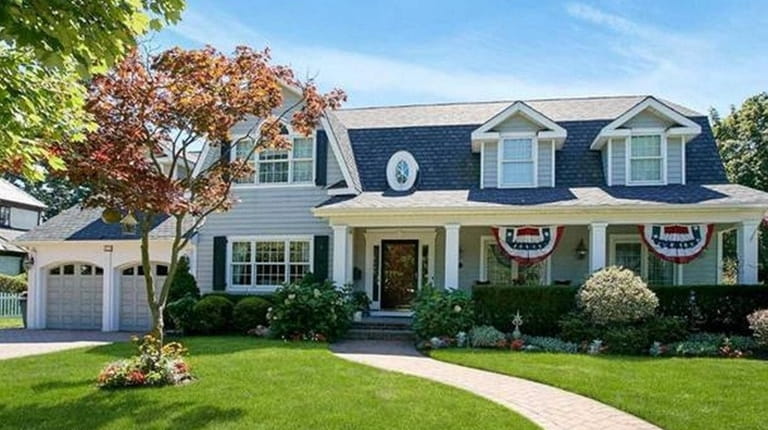 This high-end house, a Colonial in Rockville Centre, is listed...