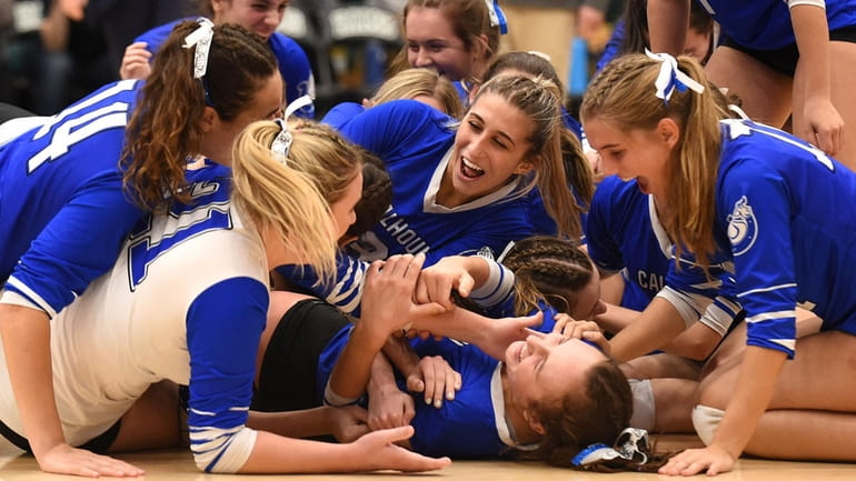 Calhoun girls volleyball teammates celebrate after their 3-1 win over...