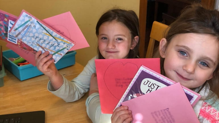 Abigail Cooper, 7, and her sister Emma, 5, made cards...