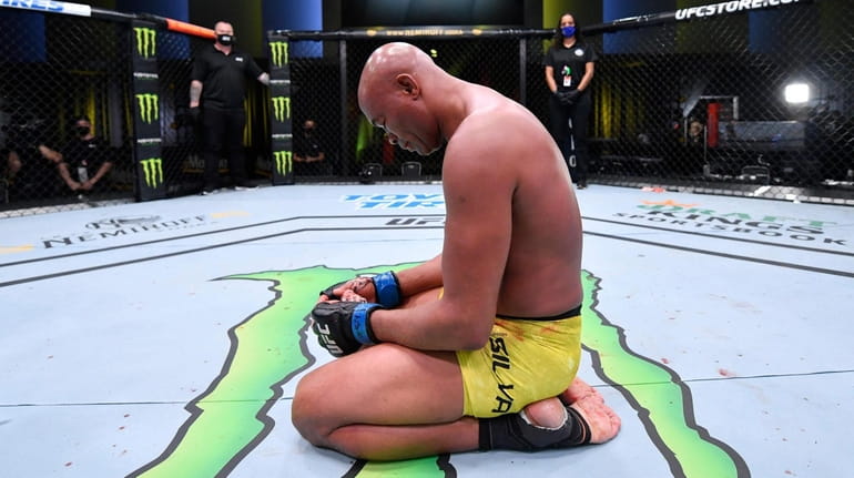 Anderson Silva reacts after his loss to Uriah Hall in...
