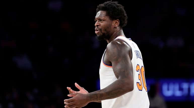 Knicks forward Julius Randle reacts to being called for a...
