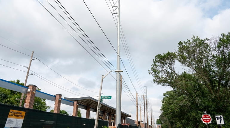 Large steel poles beside Merillon Avevenue LIRR station in Garden City...