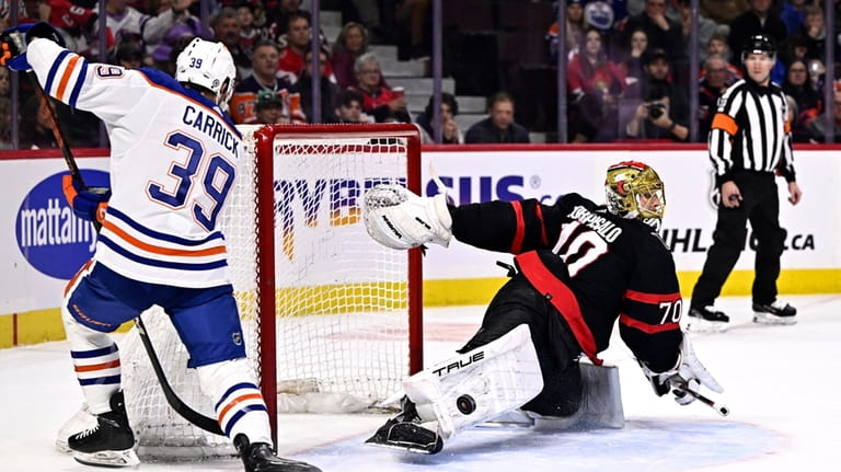 Ottawa Senators goaltender Joonas Korpisalo (70) makes a pad save...