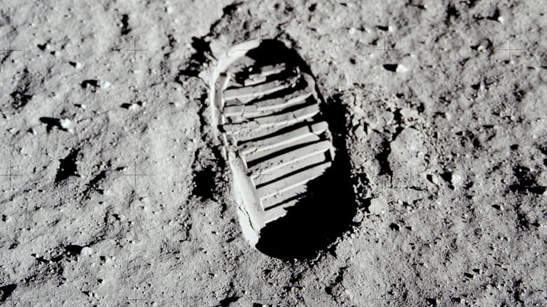 This 1969 photo released by NASA shows a boot print...