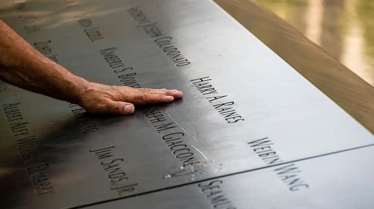 The plaque at the North Pool of the 9/11 Memorial...