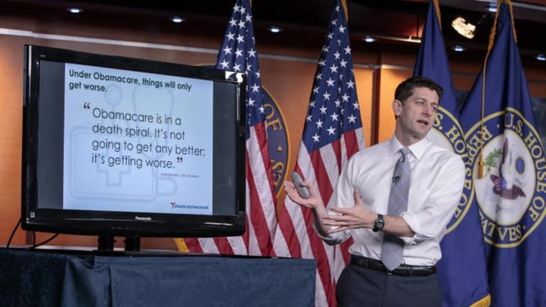 House Speaker Paul Ryan uses charts and graphs to make...