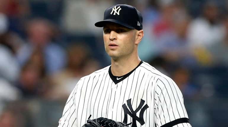 J.A. Happ #34 of the Yankees looks on during the...