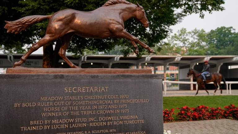 A statue dedicated to 1973 Triple Crown winner Secretariat stands...