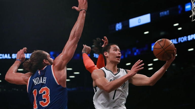 Jeremy Lin #7 of the Brooklyn Nets goes up for...